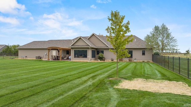 9345 Notestine Rd, Fort Wayne, IN 46835 - back of house featuring a fenced backyard, a patio area, and a shingled roof