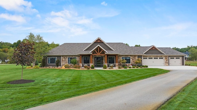 9345 Notestine Rd, Fort Wayne, IN 46835 - craftsman-style house featuring an attached garage, concrete driveway, stone siding, and a front yard