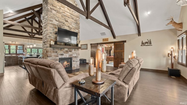 9345 Notestine Rd, Fort Wayne, IN 46835 - living area with high vaulted ceiling, wood finished floors, a fireplace, beam ceiling, and a chandelier