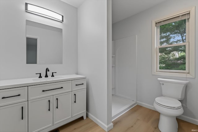 50588 Carrington Place Dr, South Bend, IN 46637 - full bathroom featuring wood finished floors, vanity, and a shower