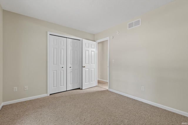 51613 Emmons Rd, South Bend, IN 46637 - unfurnished bedroom with light carpet and a closet