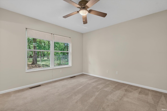 51613 Emmons Rd, South Bend, IN 46637 - spare room featuring light colored carpet and ceiling fan