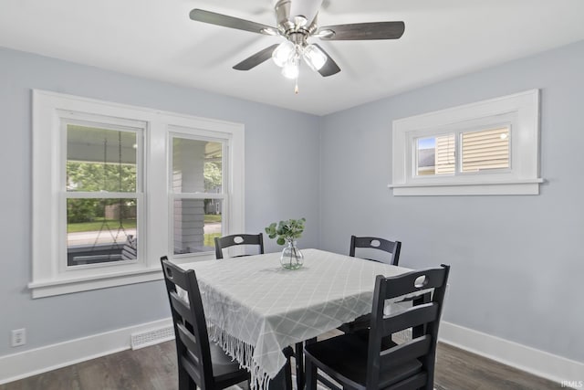 1323 Lincolnway E, Mishawaka, IN 46544 - dining room with healthy amount of natural light, dark wood-style flooring, and a ceiling fan