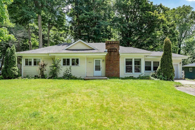4648 Parkerdale Dr, Fort Wayne, IN 46815 - ranch-style house with a chimney, an attached garage, a front yard, and roof with shingles