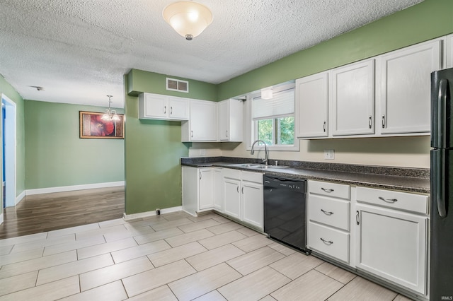 4648 Parkerdale Dr, Fort Wayne, IN 46815 - kitchen featuring black appliances, dark countertops, white cabinets, a textured ceiling, and wood finish floors