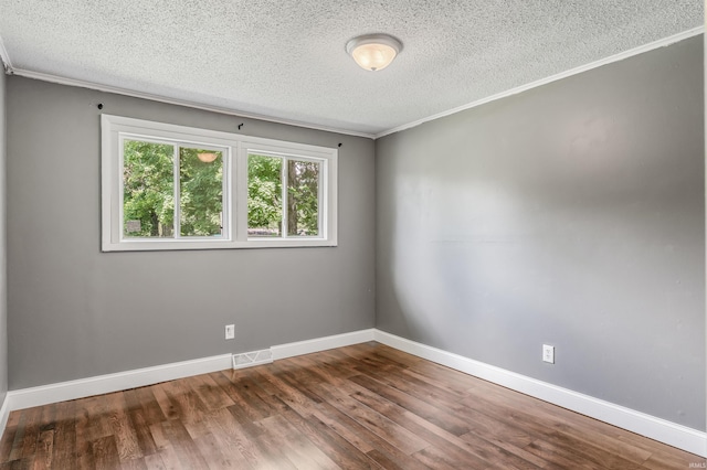 4648 Parkerdale Dr, Fort Wayne, IN 46815 - empty room with a textured ceiling, wood finished floors, and crown molding