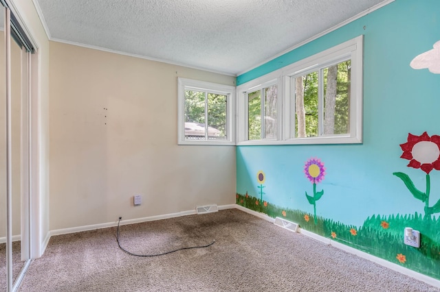 4648 Parkerdale Dr, Fort Wayne, IN 46815 - empty room with healthy amount of natural light, a textured ceiling, carpet flooring, and crown molding