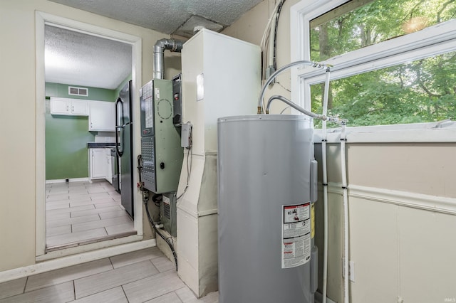 4648 Parkerdale Dr, Fort Wayne, IN 46815 - utility room featuring water heater and heating unit