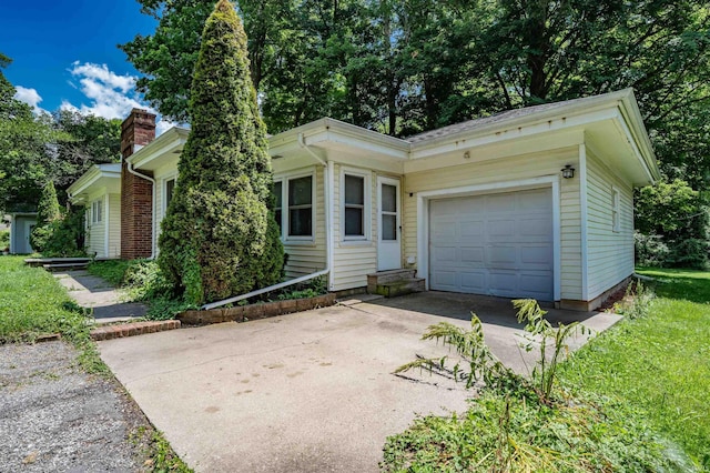 4648 Parkerdale Dr, Fort Wayne, IN 46815 - view of front of home featuring driveway, a garage, and a chimney