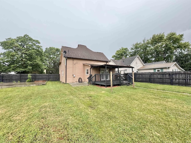 808 19th St, Logansport, IN 46947 - back of property featuring a wooden deck and a fenced backyard