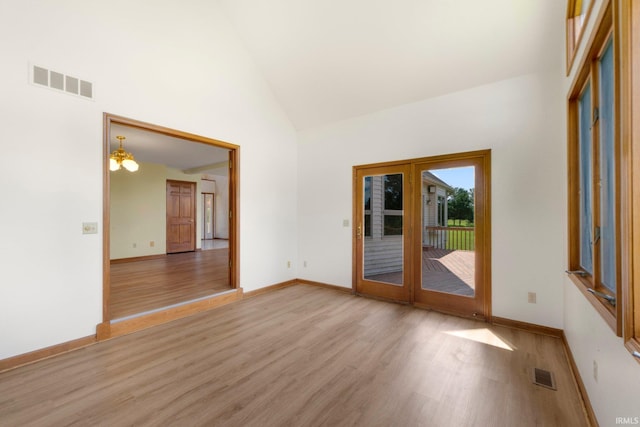 6625 Union Chapel Rd, Fort Wayne, IN 46845 - spare room featuring light wood finished floors and high vaulted ceiling