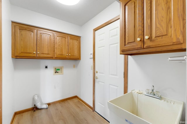 6625 Union Chapel Rd, Fort Wayne, IN 46845 - washroom with electric dryer hookup, light wood-style flooring, cabinet space, and hookup for a washing machine