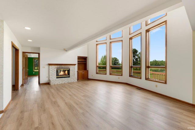 6625 Union Chapel Rd, Fort Wayne, IN 46845 - unfurnished living room featuring light wood-style flooring, recessed lighting, and a fireplace