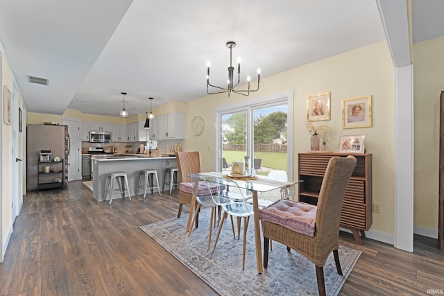 10729 Lone Tree Pl, Fort Wayne, IN 46818 - dining space featuring a chandelier and dark wood-style floors