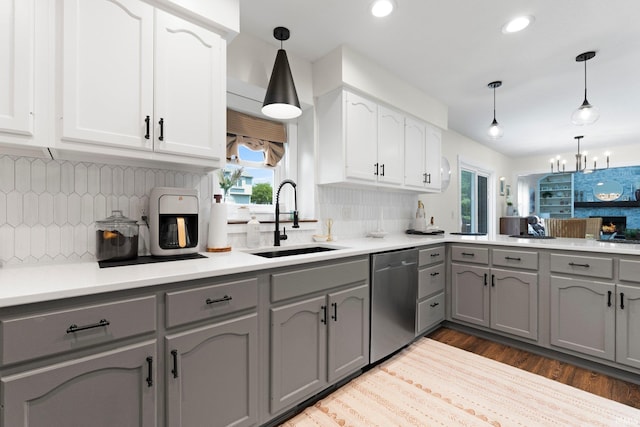10729 Lone Tree Pl, Fort Wayne, IN 46818 - kitchen featuring dishwasher, gray cabinetry, healthy amount of natural light, tasteful backsplash, and recessed lighting
