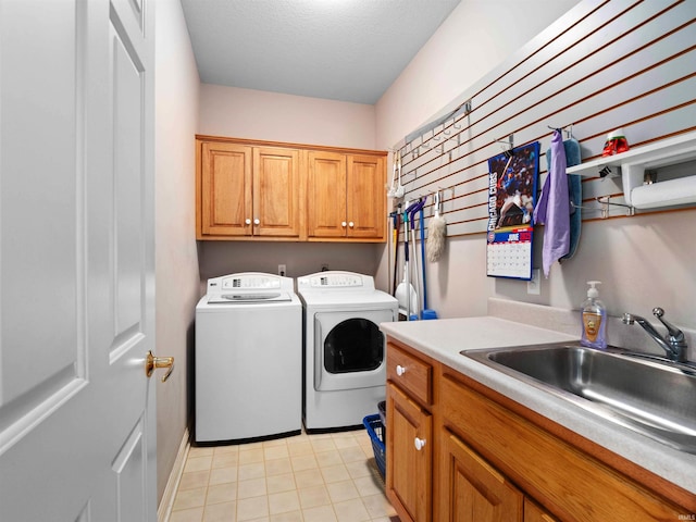 1106 Woodland Xing, Fort Wayne, IN 46825 - laundry room with cabinet space, washing machine and dryer, and light tile patterned flooring