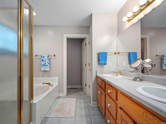 1106 Woodland Xing, Fort Wayne, IN 46825 - bathroom with a bath, a shower stall, double vanity, and tile patterned flooring
