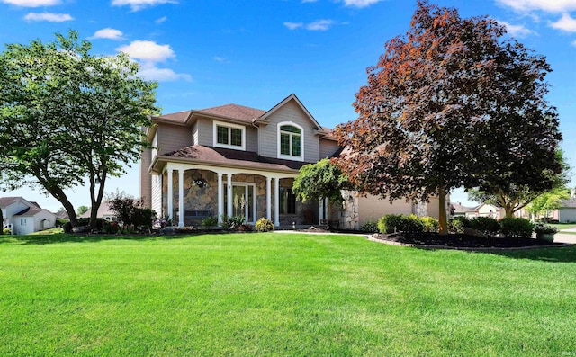 1106 Woodland Xing, Fort Wayne, IN 46825 - traditional-style house with stone siding and a front lawn