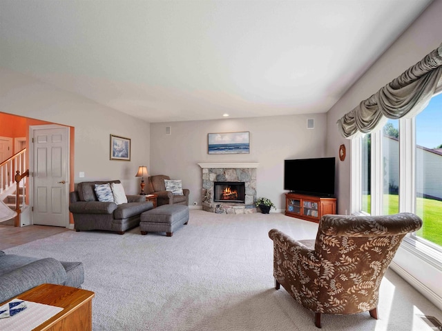 1106 Woodland Xing, Fort Wayne, IN 46825 - living area featuring stairs, a fireplace, and carpet floors