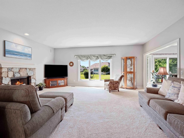 1106 Woodland Xing, Fort Wayne, IN 46825 - carpeted living area with a fireplace and recessed lighting