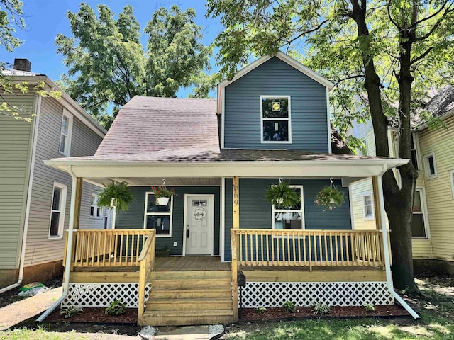 669 W Lexington Ave, Elkhart, IN 46514 - view of front of house featuring covered porch and roof with shingles