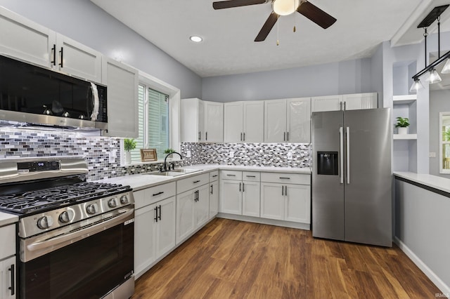 669 W Lexington Ave, Elkhart, IN 46514 - kitchen with appliances with stainless steel finishes, a ceiling fan, light countertops, dark wood-type flooring, and recessed lighting