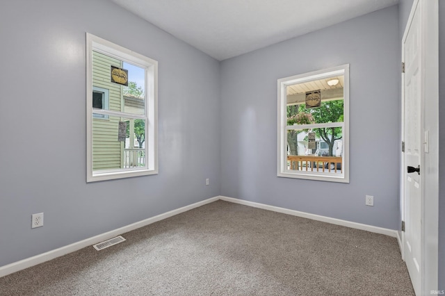 669 W Lexington Ave, Elkhart, IN 46514 - unfurnished room with carpet floors and baseboards