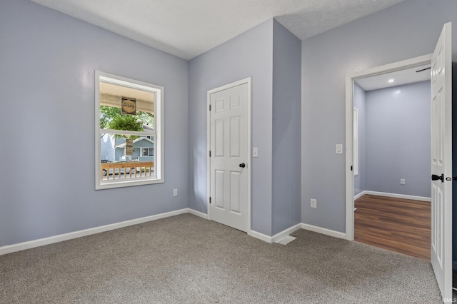 669 W Lexington Ave, Elkhart, IN 46514 - unfurnished bedroom featuring carpet and baseboards