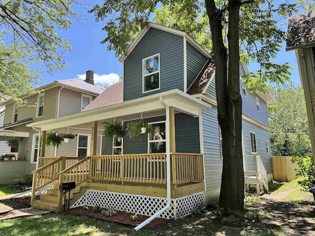669 W Lexington Ave, Elkhart, IN 46514 - view of front facade with a porch and roof with shingles