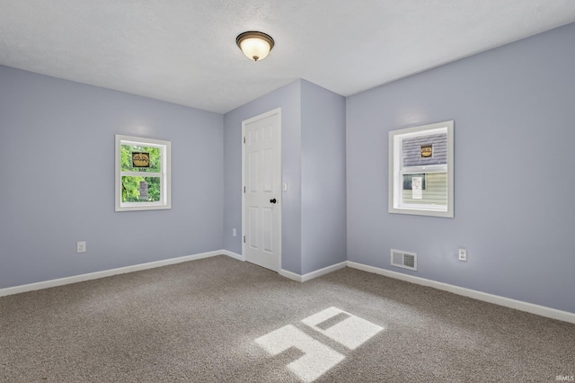 669 W Lexington Ave, Elkhart, IN 46514 - unfurnished room featuring carpet