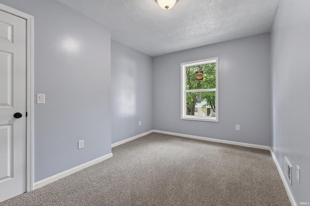 669 W Lexington Ave, Elkhart, IN 46514 - carpeted empty room featuring a textured ceiling and baseboards