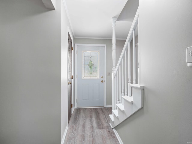 6506 Woodthrush Dr, Fort Wayne, IN 46835 - entryway featuring wood finished floors, stairway, and crown molding