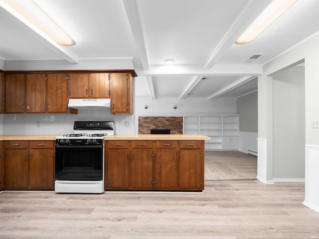 6506 Woodthrush Dr, Fort Wayne, IN 46835 - kitchen featuring gas range oven, under cabinet range hood, light wood-style floors, light countertops, and brown cabinetry