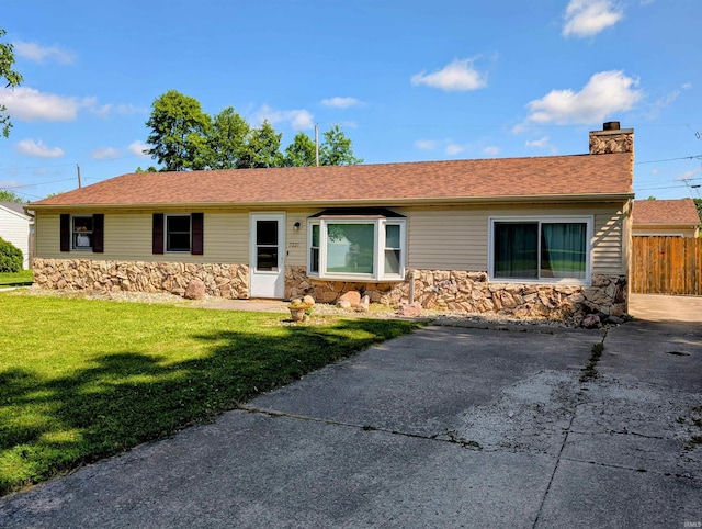 7221 Pumpkin Ln, Fort Wayne, IN 46835 - ranch-style home with stone siding and a chimney