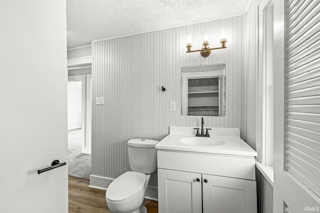 533 Altgeld St, South Bend, IN 46614 - bathroom with a textured ceiling, vanity, and wood finished floors