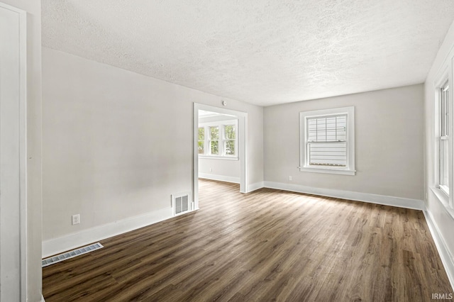 533 Altgeld St, South Bend, IN 46614 - unfurnished room with a textured ceiling and wood finished floors