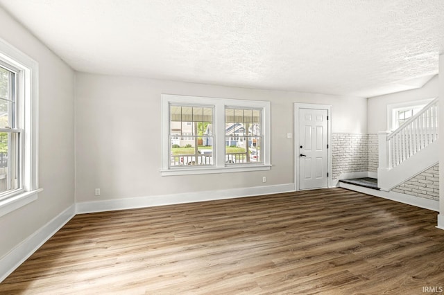 533 Altgeld St, South Bend, IN 46614 - foyer with wood finished floors, a textured ceiling, and stairs