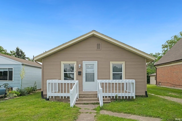 3014 Drexel Ave, Fort Wayne, IN 46806 - bungalow-style house with a front yard and covered porch