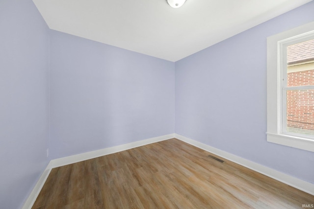 3014 Drexel Ave, Fort Wayne, IN 46806 - empty room featuring wood finished floors and healthy amount of natural light