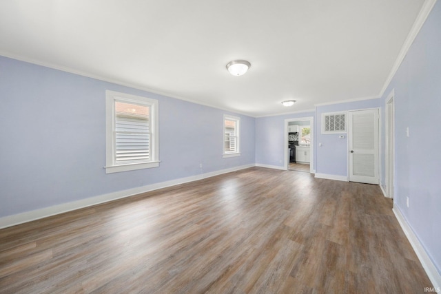 3014 Drexel Ave, Fort Wayne, IN 46806 - unfurnished living room with ornamental molding and wood finished floors