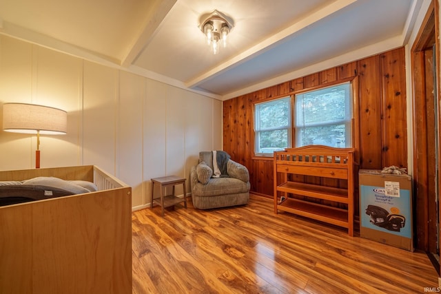 1712 Royal Center Pike, Logansport, IN 46947 - sitting room with beam ceiling, wood finished floors, and a decorative wall