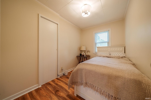 1712 Royal Center Pike, Logansport, IN 46947 - bedroom with ornamental molding, wood finished floors, and a closet