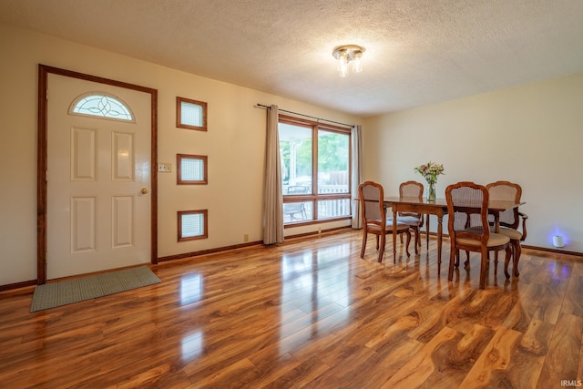 1712 Royal Center Pike, Logansport, IN 46947 - dining area featuring wood finished floors and a textured ceiling