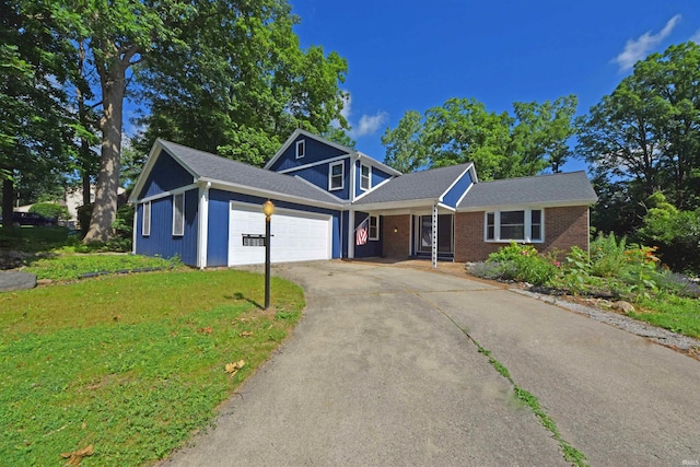 9818 Houndshill Pl, Fort Wayne, IN 46804 - traditional home with a garage, a front lawn, concrete driveway, and brick siding