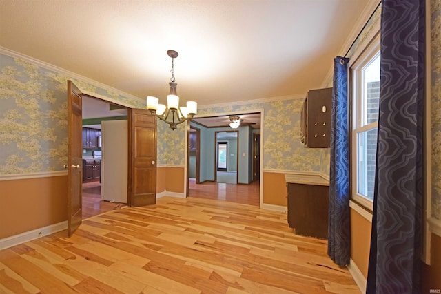 9818 Houndshill Pl, Fort Wayne, IN 46804 - unfurnished dining area featuring light wood finished floors, a chandelier, a wainscoted wall, wallpapered walls, and ornamental molding