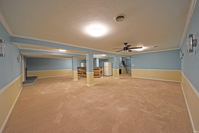 9818 Houndshill Pl, Fort Wayne, IN 46804 - finished basement with ornamental molding, a textured ceiling, freestanding refrigerator, and carpet floors