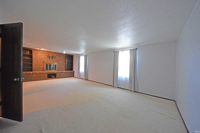 9818 Houndshill Pl, Fort Wayne, IN 46804 - unfurnished living room featuring carpet, a fireplace, built in features, and a textured ceiling