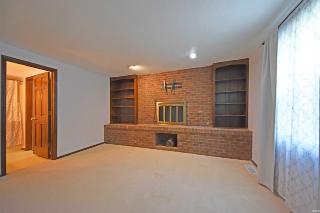 9818 Houndshill Pl, Fort Wayne, IN 46804 - unfurnished living room featuring built in features, carpet flooring, and a brick fireplace