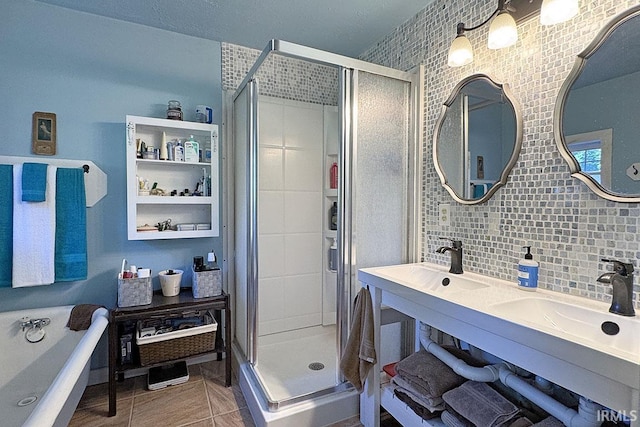 68615 County Road 23, New Paris, IN 46553 - bathroom featuring a stall shower, a tub to relax in, decorative backsplash, double vanity, and tile patterned flooring
