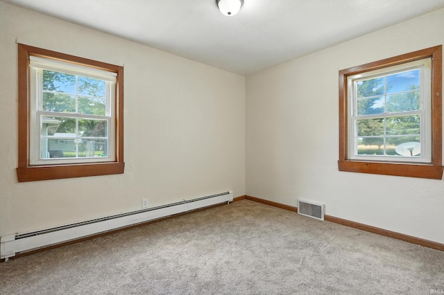 58 W Markle Rd, Huntington, IN 46750 - spare room featuring a baseboard radiator, carpet floors, and healthy amount of natural light